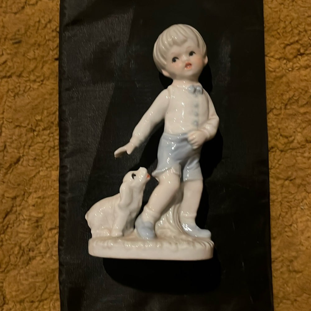 Vintage KPM porcelain young boy with puppy figurine